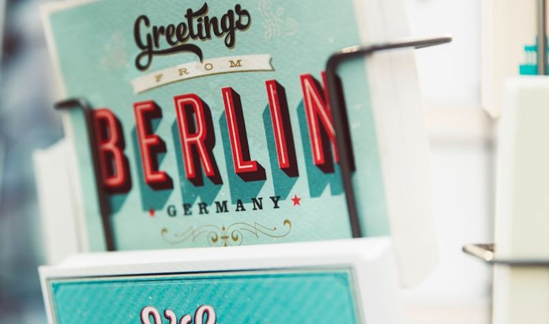shallow focus photography of greeting cards on rack