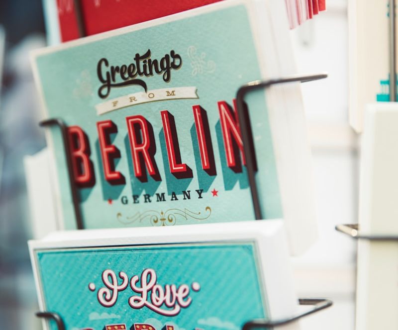 shallow focus photography of greeting cards on rack