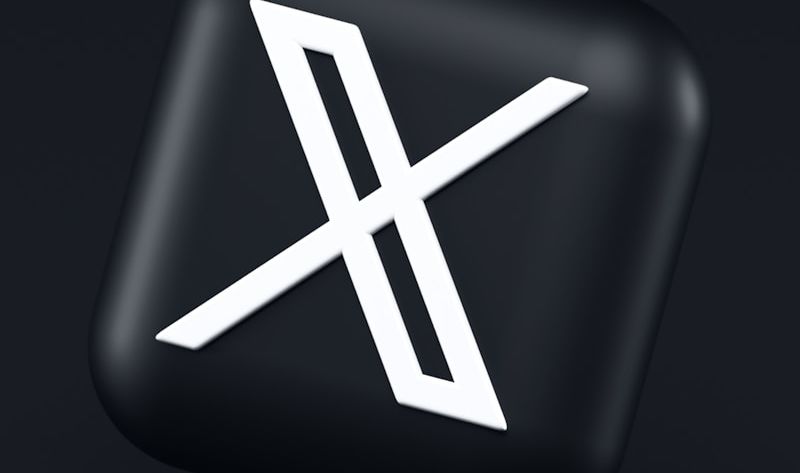 a black button with a white symbol on it